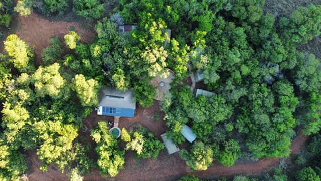 Aerial view of the Cowley Safaris Tented Bush Camp among the trees