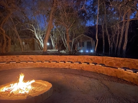 Circular seating around the Tented Bush Camp fire
